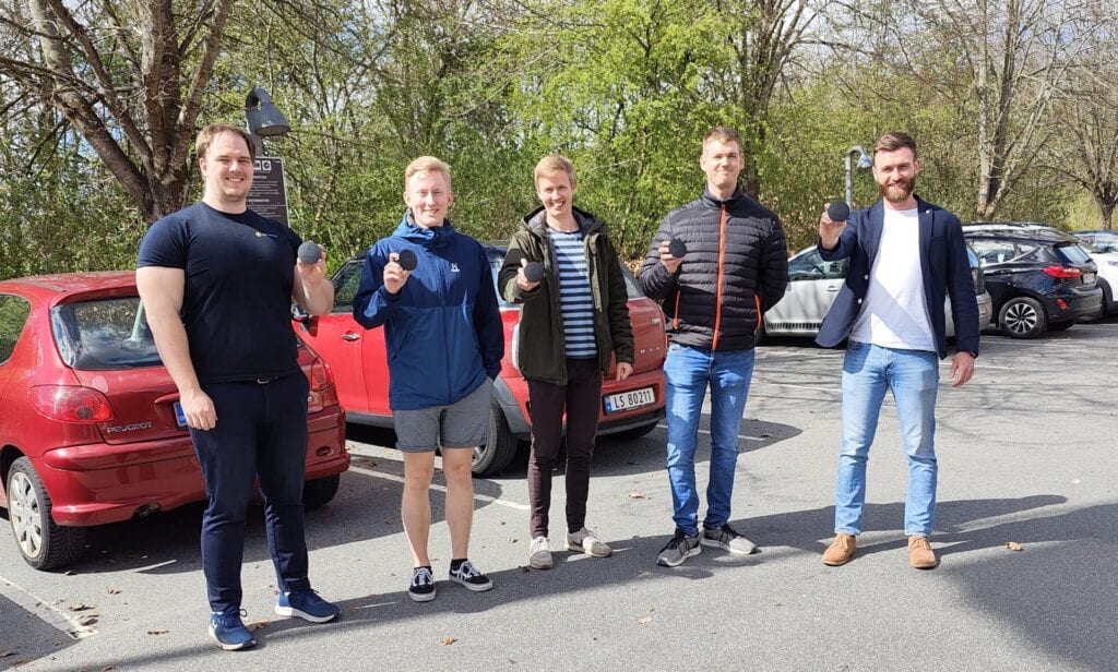Sensade team members at a parking site installation